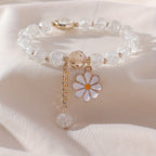 Crackle-glazen kralenarmband met madeliefjeshanger