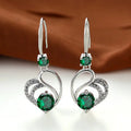Oorhangers met groene steen en krul