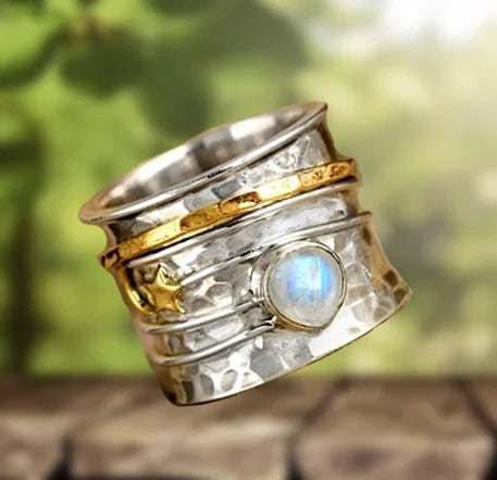 Spinnerring met ster, maan en maansteen