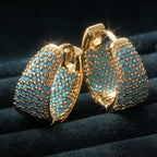 Goudkleurige oorringen met turquoise kralen