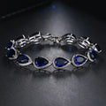 Schakelarmband met blauwe druppelsteen