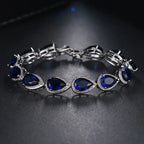 Schakelarmband met blauwe druppelsteen