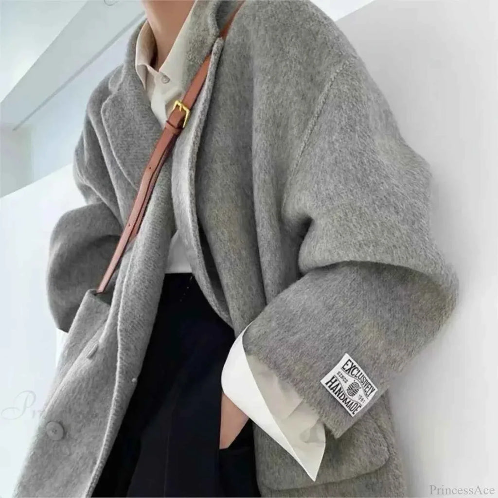 Single Breasted V Neck Longline Coat with a Wide Waist Cut