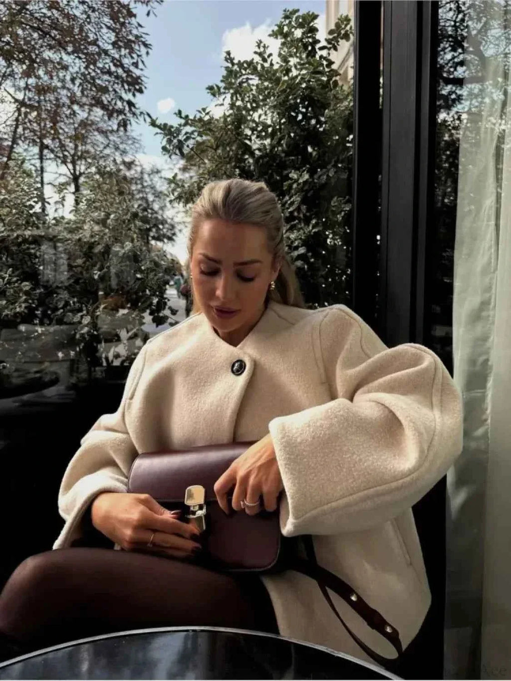 Short Soft Knit Coat with a Round Collar and a Loose Fit