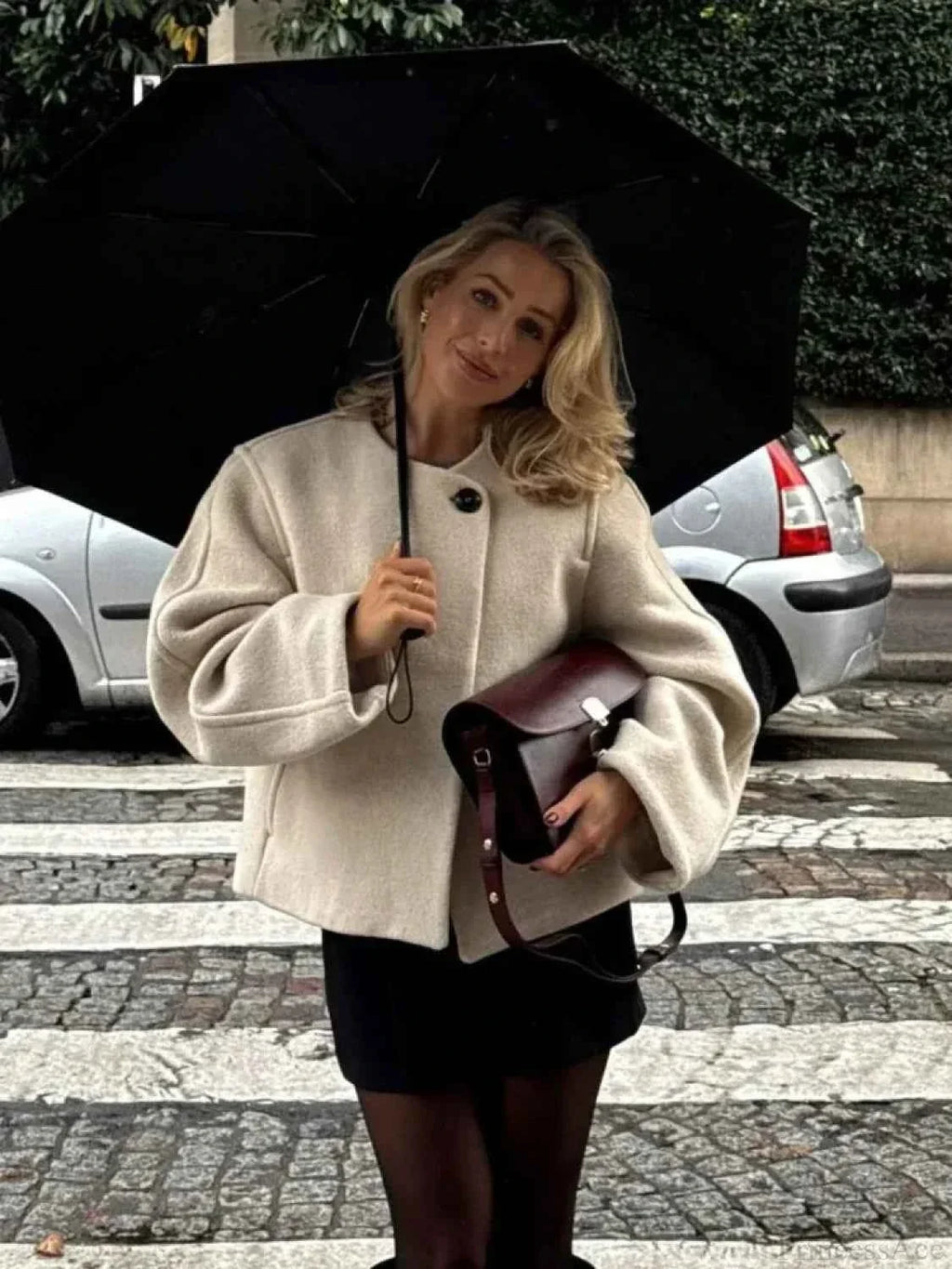 Short Soft Knit Coat with a Round Collar and a Loose Fit
