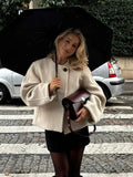 Short Soft Knit Coat with a Round Collar and a Loose Fit