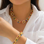 Kleurrijke set van schakelarmband en ketting