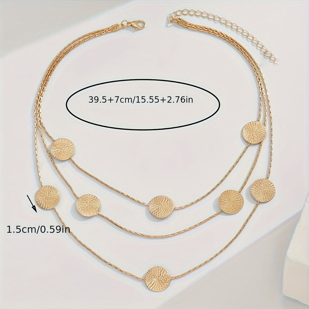 Geometrische gelaagde ketting met spiraaltextuur en meerdere schijfjes