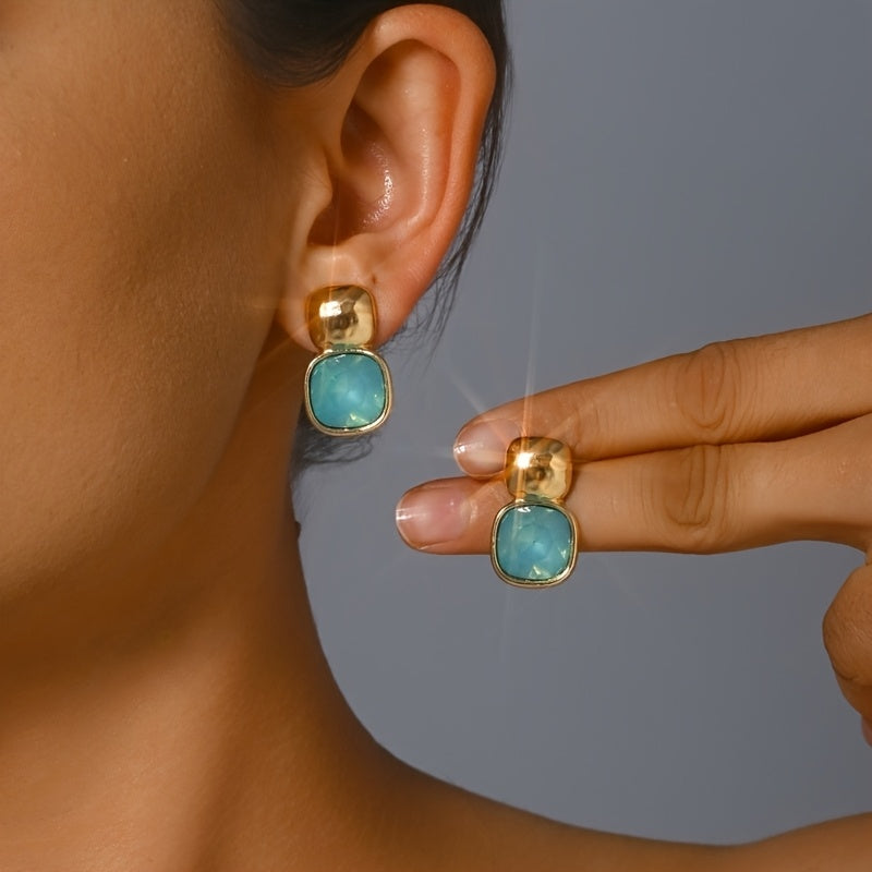 Goudkleurige oorknopjes met vierkante turquoise steen