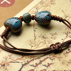 Keramische kralenarmband met hartjes in blauw en bruin