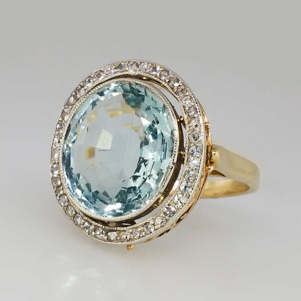 Ronde goudkleurige ring met blauw glas
