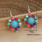 Bloemenoorhangers met turkoois en koraallook