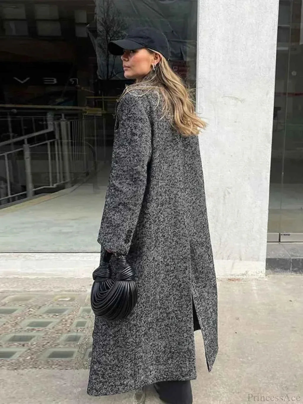 Faux Fur Coat with Patchwork Panels and a Tie Fastening