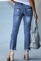 Ripped jeans met knoopsluiting en zakken voor