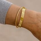 Classic Gold-Tone Bracelet with a Smooth Flowing Shape