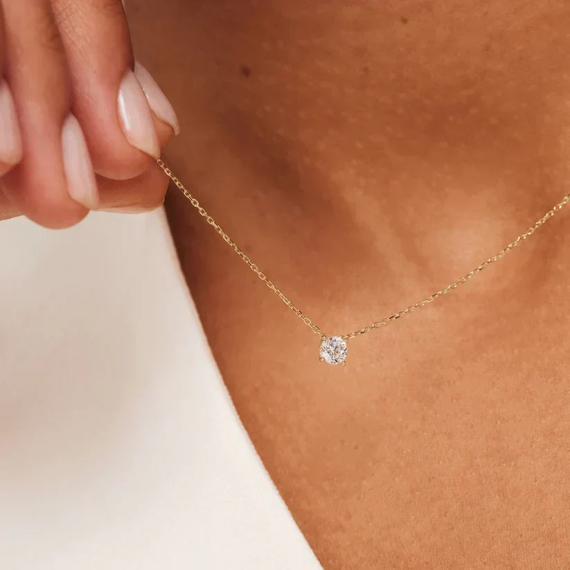 Ketting met moissanietsteen in drie metaaltinten