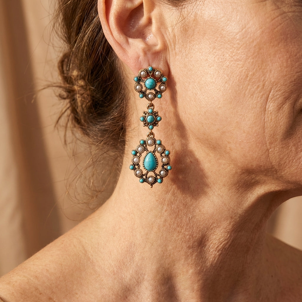 Vergulde bloemenoorbellen met turquoise en parel