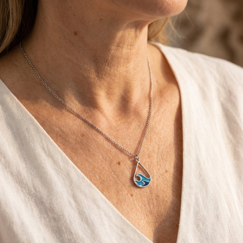 Zilverkleurige ketting met turquoise bedel