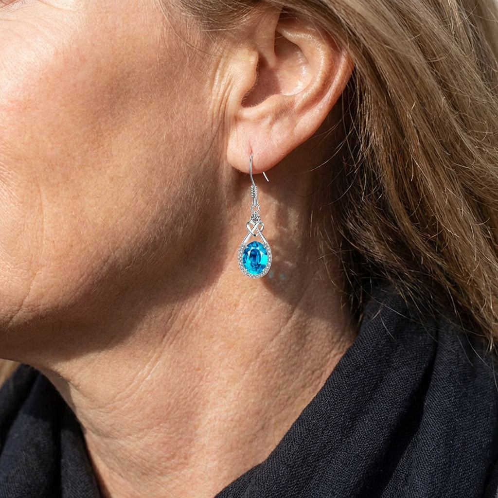 Blauwe ovale oorhangers met halo