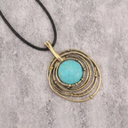 Lange ketting van zwart waskoord met turquoise steen
