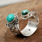 Verstelbare open ring met twee turquoise stenen