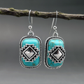 Etnische verzilverde oorbellen met turquoise steen