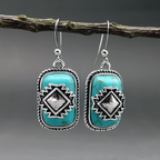 Etnische verzilverde oorbellen met turquoise steen