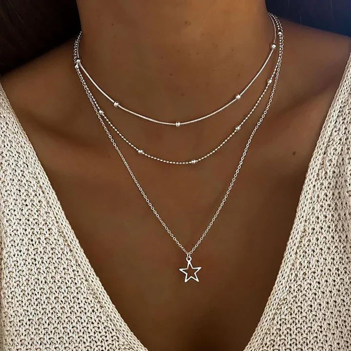 Zilverkleurige drielaagse schakelketting met sterhanger