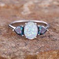 White Opal-Look Ring with Blue Side Stones