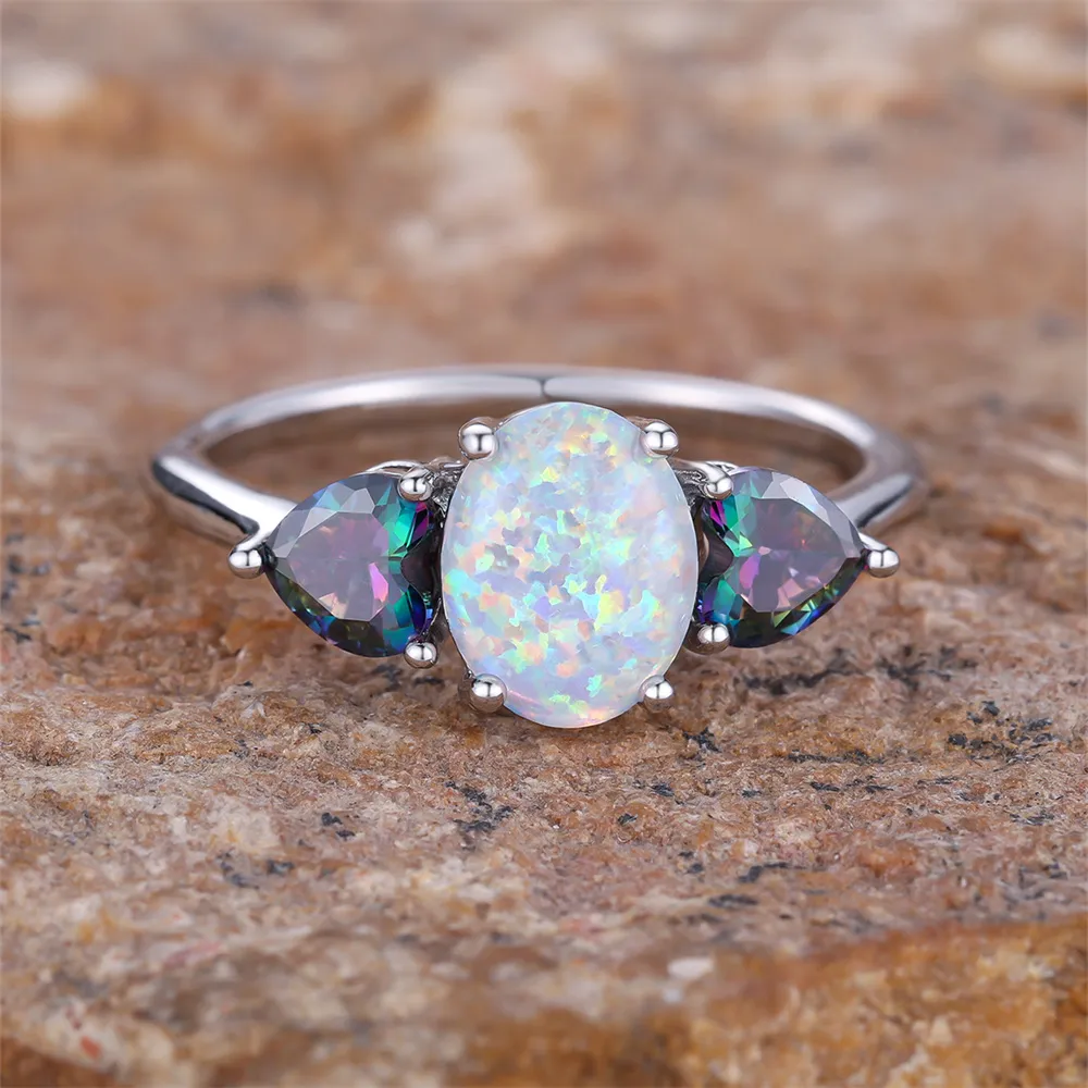 White Opal-Look Ring with Blue Side Stones