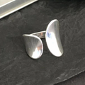 Open zilverkleurige peddelring