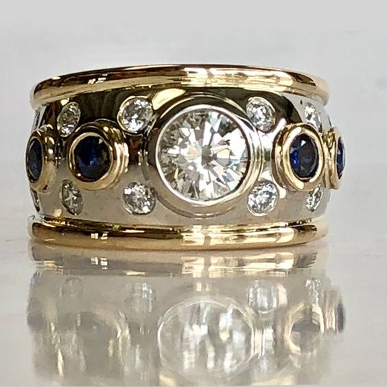 Gold-Tone Band Ring with Dark Blue and Clear Zirconia Row