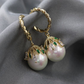Twisted Gold-Tone Hoop Earrings with Pearl and Leaf Cap