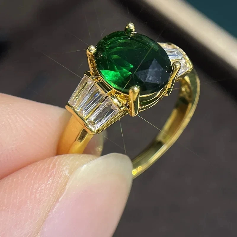 Green Zirconia Ring with Baguette Side Stones in Gold Tone