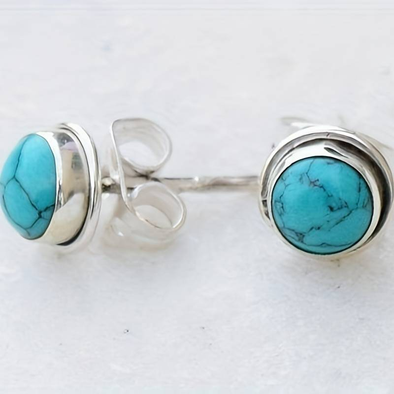 Vintage zilverkleurige oorbellen ingelegd met blauwe steen