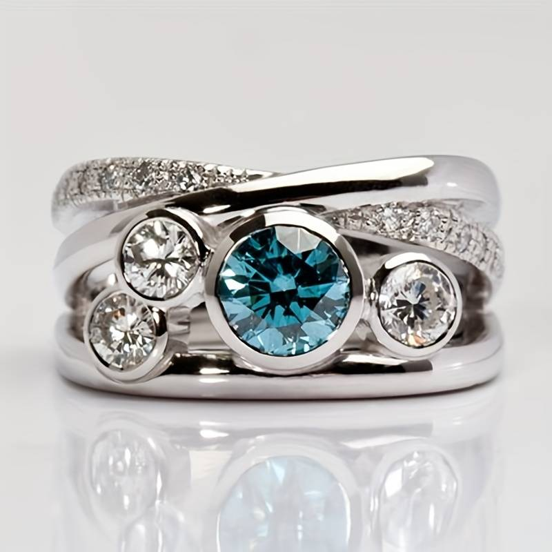 Silver-Tone Band with Blue Zirconia and Clear Bezel Stones