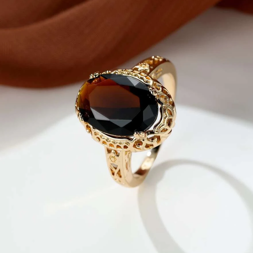 Oval Dark Stone Ring with Filigree Gold-Tone Band
