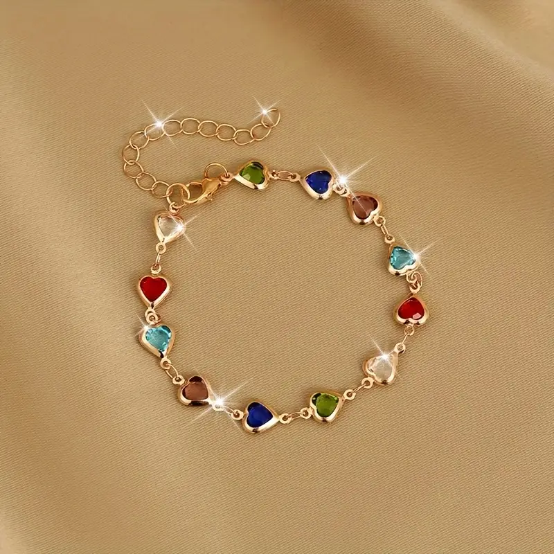 Goudkleurige armband met kleurrijke hartjes