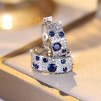 Galaxy-oorringen met blauwe en witte stenen