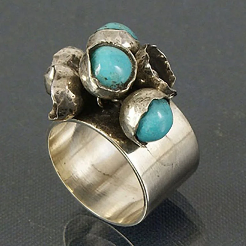 Vintage zilverkleurige ring ingelegd met blauwe stenen