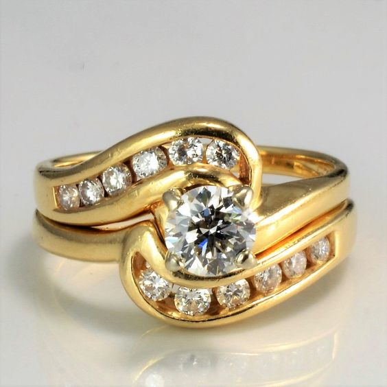 Gold-Tone Wave Ring with Zirconia Channel and Centre Stone