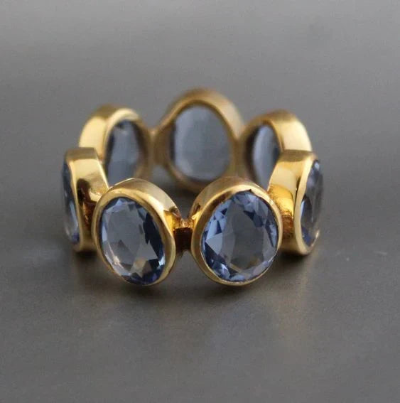 Gold-Tone Ring with Row of Blue Glass Bezels