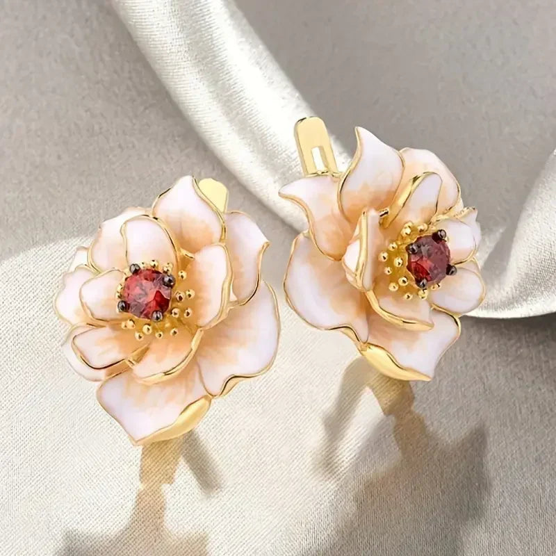 White Flower Red Zirconia Earrings in Gold Tone
