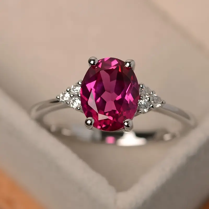 Oval ring i vintagestil med granat-look