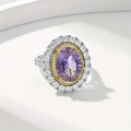 Ronde zilverkleurige ring met paarse zirkonia