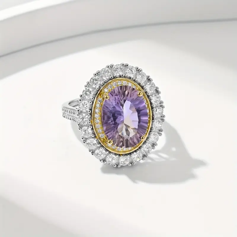 Ronde zilverkleurige ring met paarse zirkonia