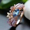 Veerring met blauw kristal