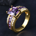 Violet Glass Ring with Channel-Set Side Stones in Gold Tone