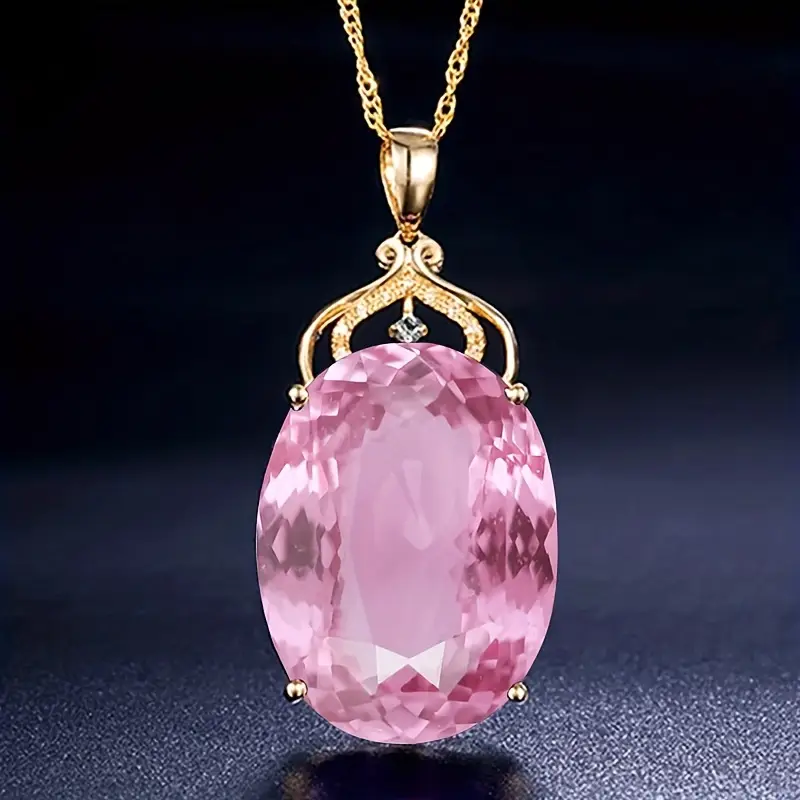 Goudkleurige ketting met roze glas
