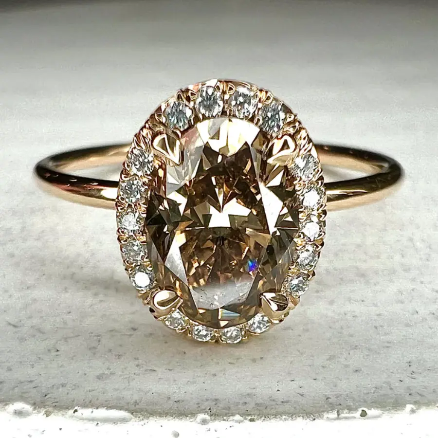 Ronde goudkleurige ring met glas